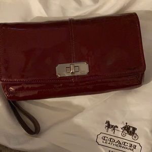 coach.   Wristlet. Detachable wristband Wine color